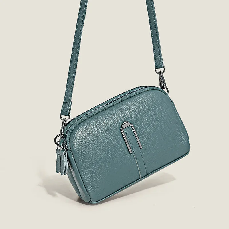 Minimalist crossbody bag in top-grain leather with spliced design, horizontal square shape, inner zippered pocket