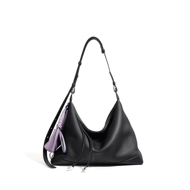Full-grain leather women's crossbody bag in biscuit with spliced design and zip closure