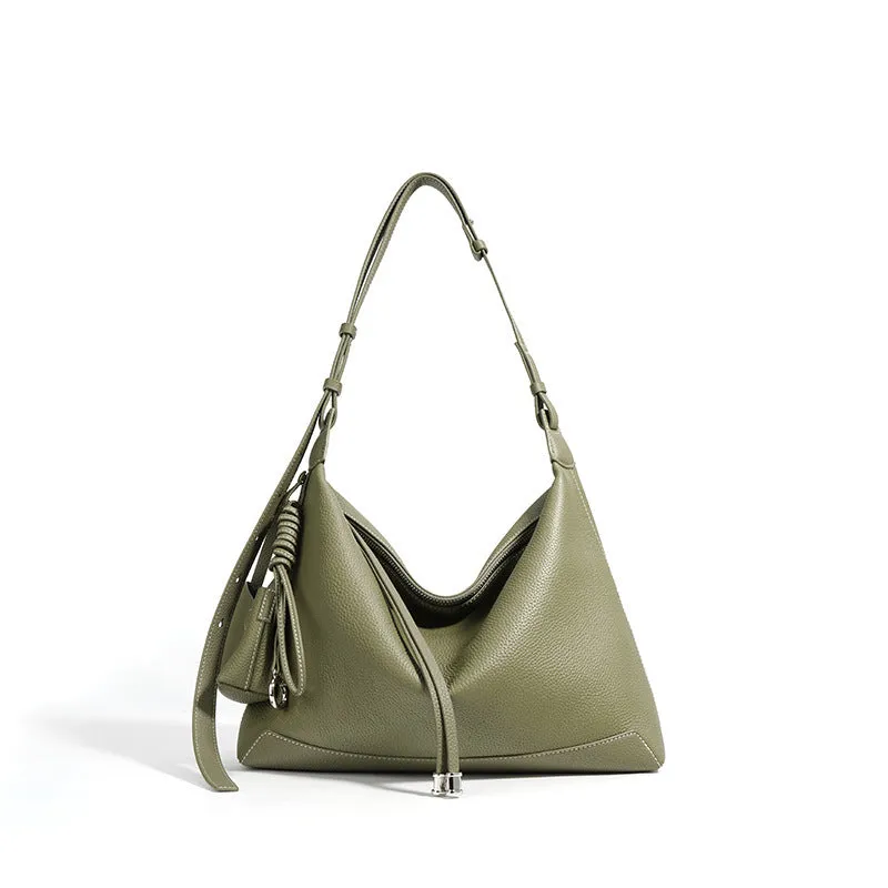 Full-grain leather women's crossbody bag in biscuit with spliced design and zip closure