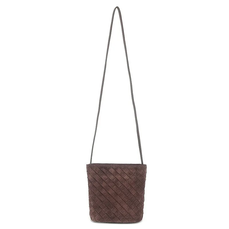 Cowhide leather barrel-shaped zip crossbody bag in black with weaving detail and crossbody strap