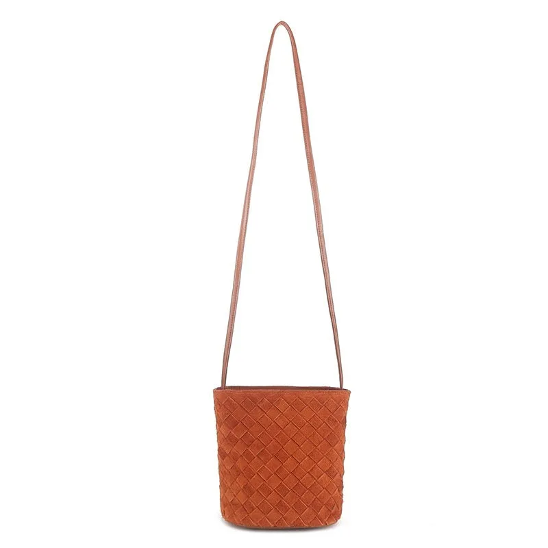 Cowhide leather barrel-shaped zip crossbody bag in black with weaving detail and crossbody strap