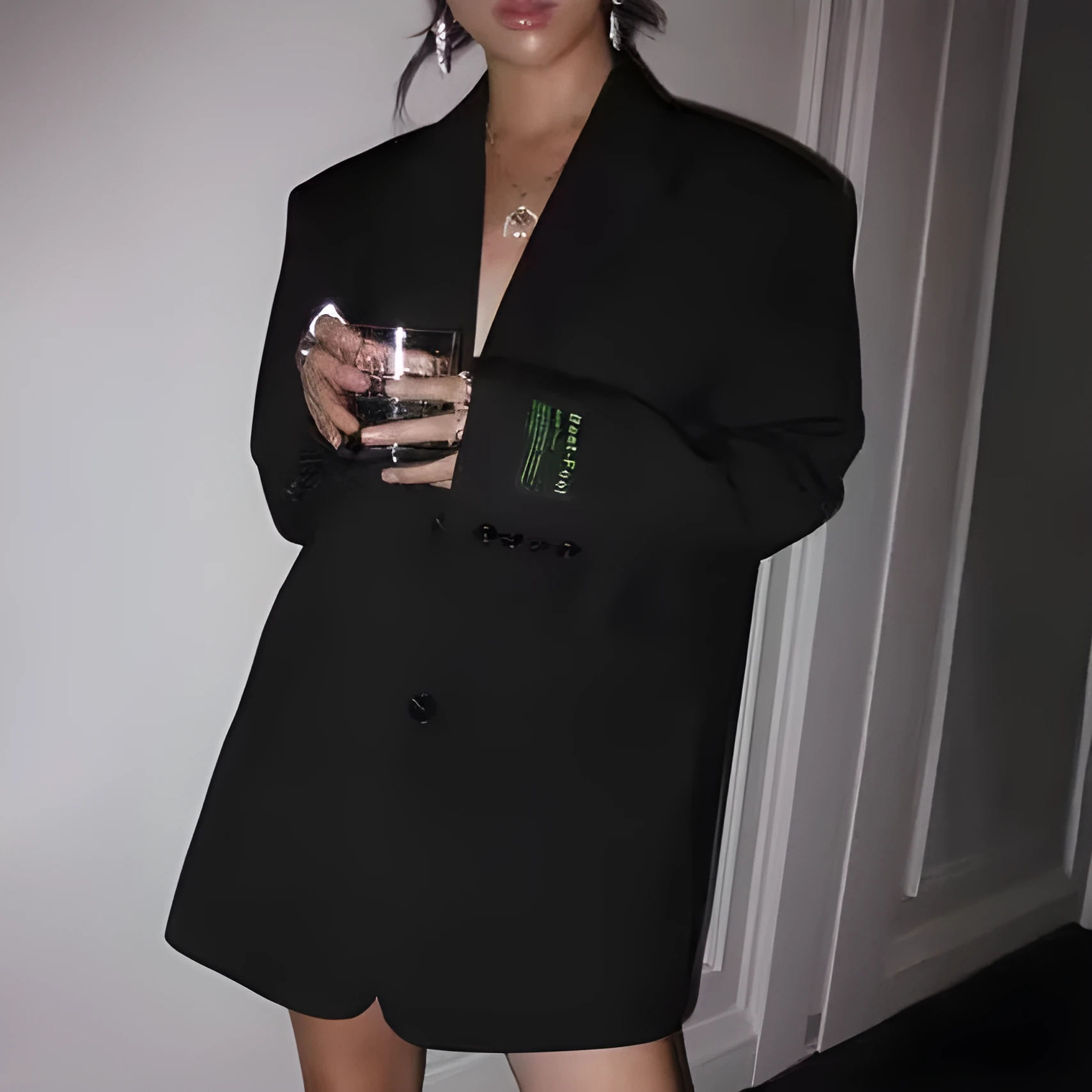 Retro loose black women's polyester suit jacket with pockets, front view, long sleeves, mid-length