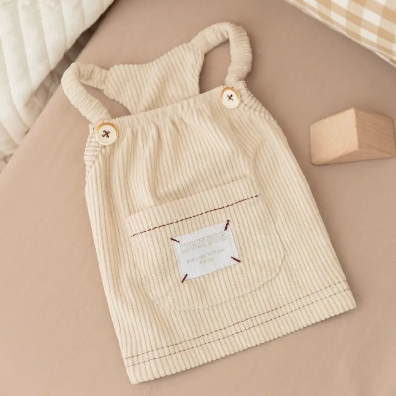 Brown corduroy pet vest with wool Sherpa collar on a small dog, halter design for easy wear