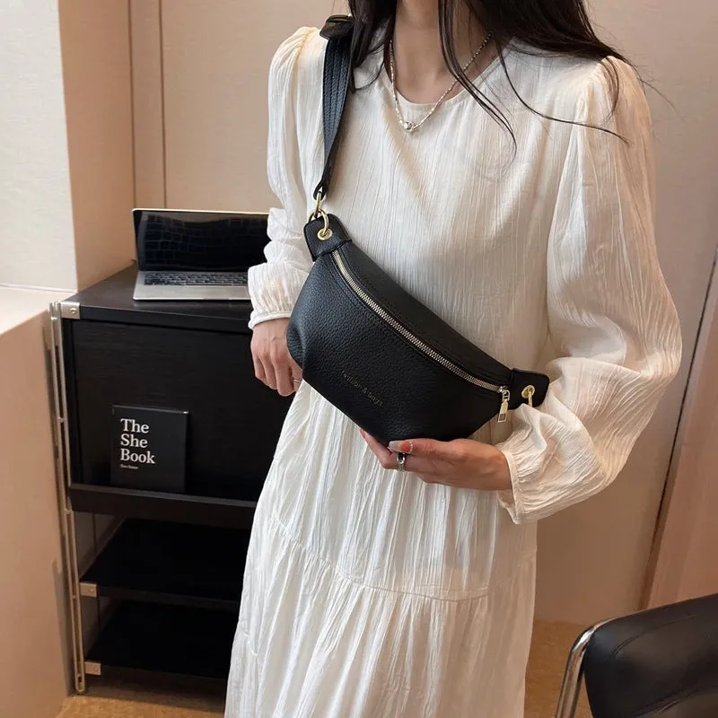 PU waist bag with spliced design in black showing single-shoulder style and zippered compartment