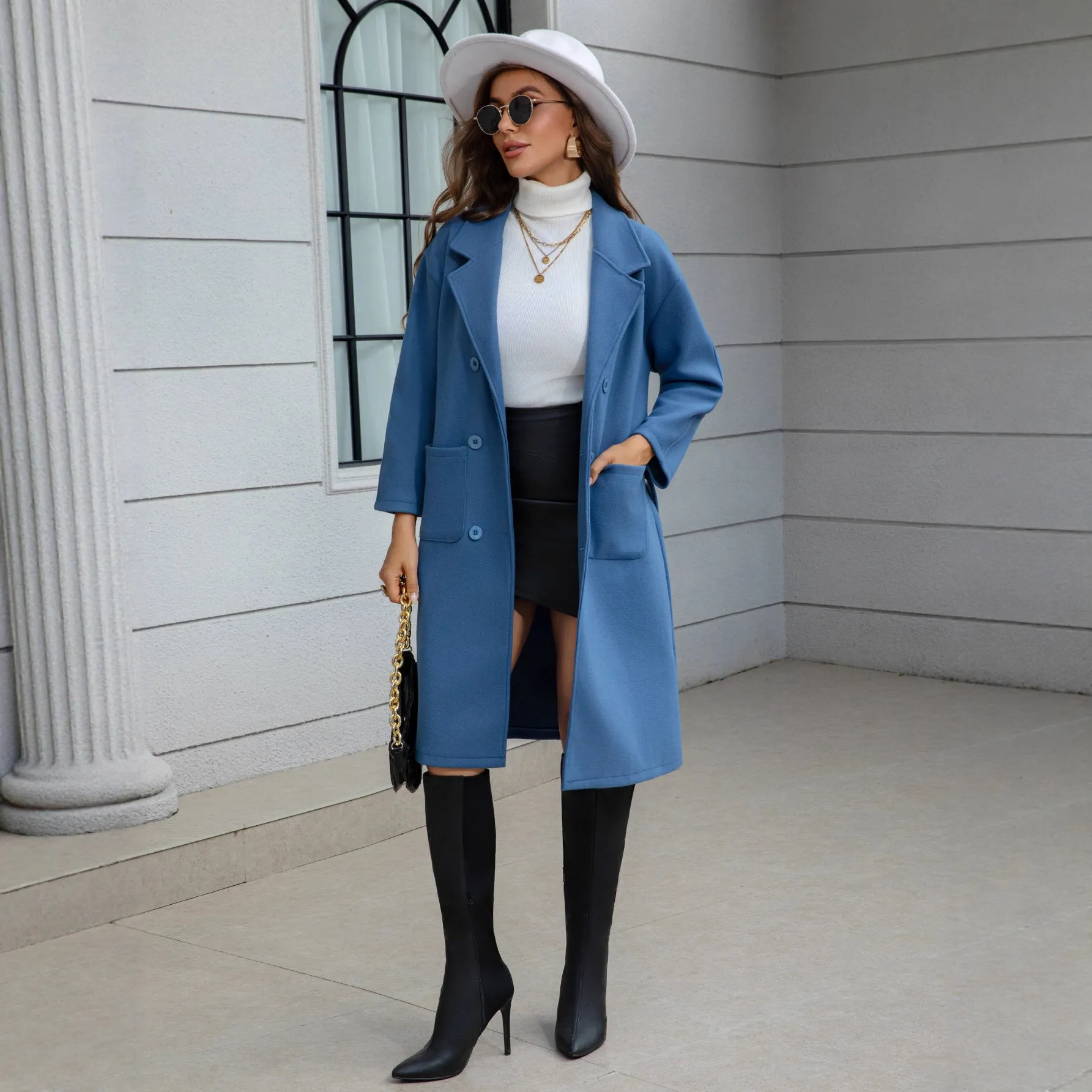 Blue waist-tie mid-length women's wool coat with patchwork pockets