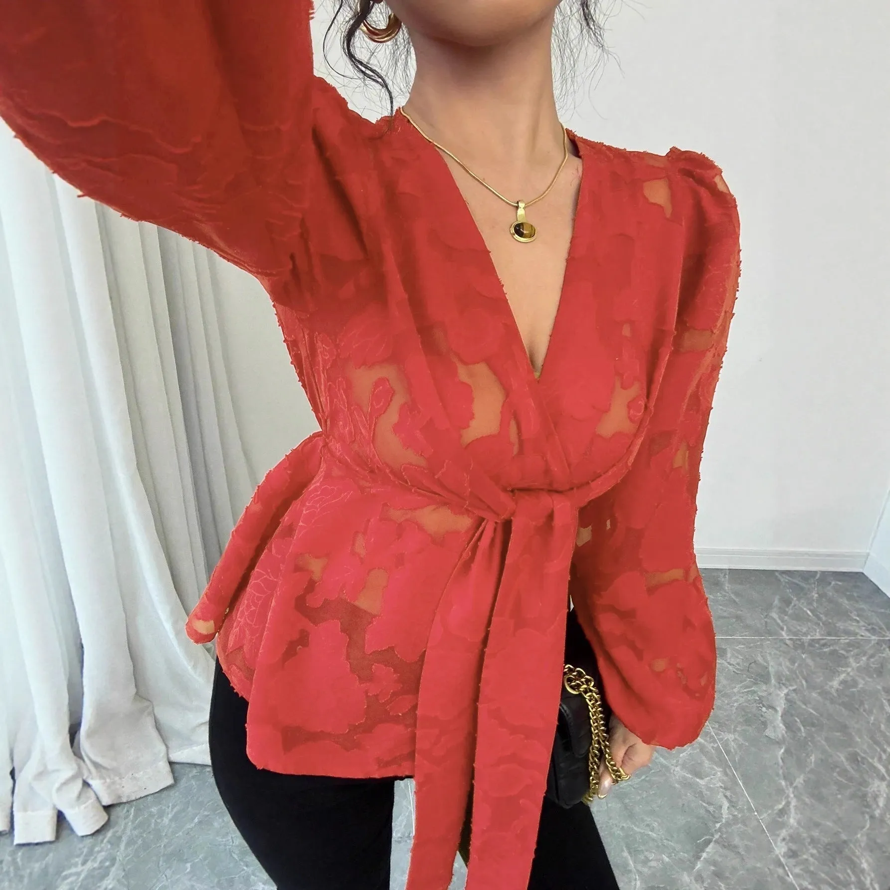 Women's black hollow out embroidery polyester shirt with V-neck and long sleeves, front view