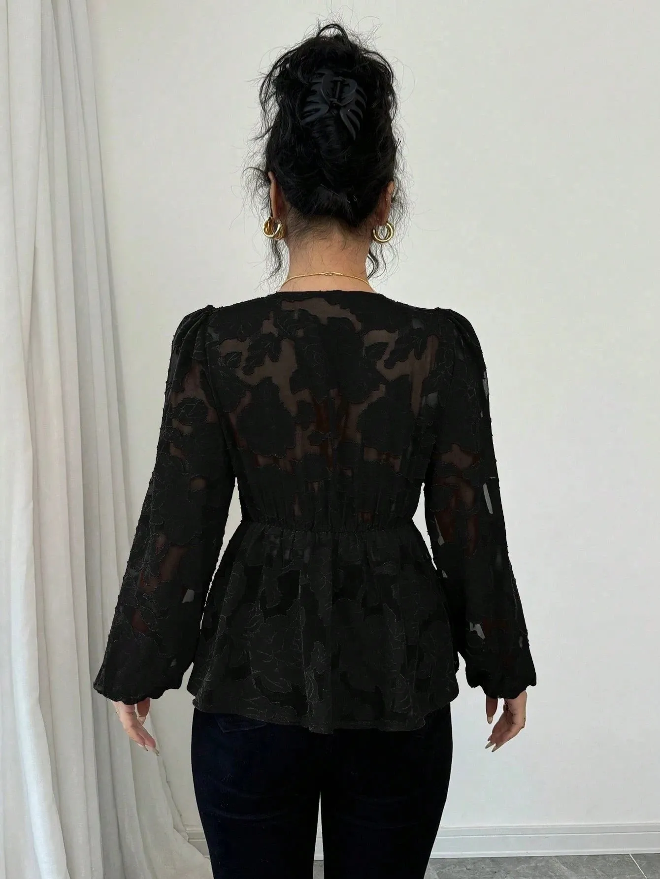 Women's black hollow out embroidery polyester shirt with V-neck and long sleeves, front view