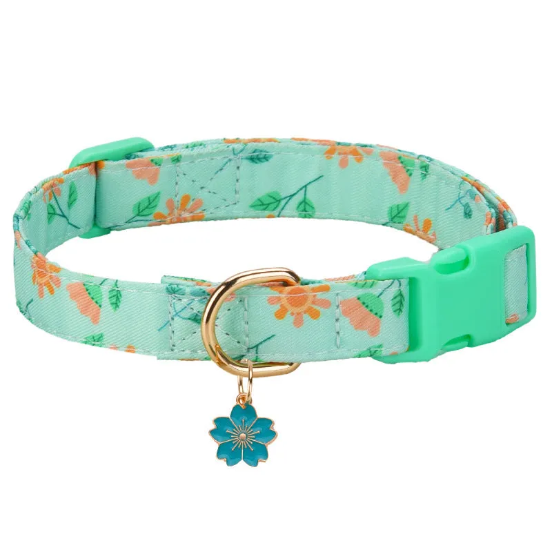 Floral polyester adjustable dog collar for traction in a pink colour, shown on a white background