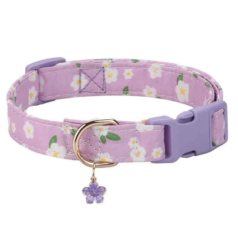 Floral polyester adjustable dog collar for traction in a pink colour, shown on a white background