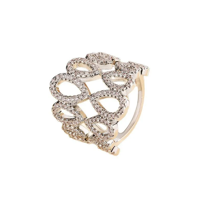 Women's gold plated copper ring with inlaid zircon stone and hexagon design on white background