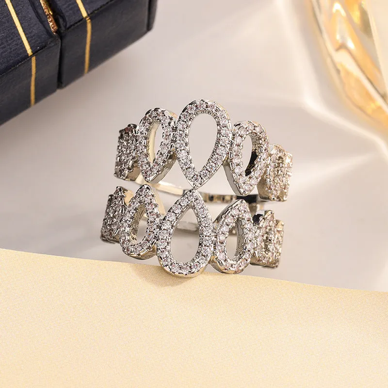 Women's gold plated copper ring with inlaid zircon stone and hexagon design on white background