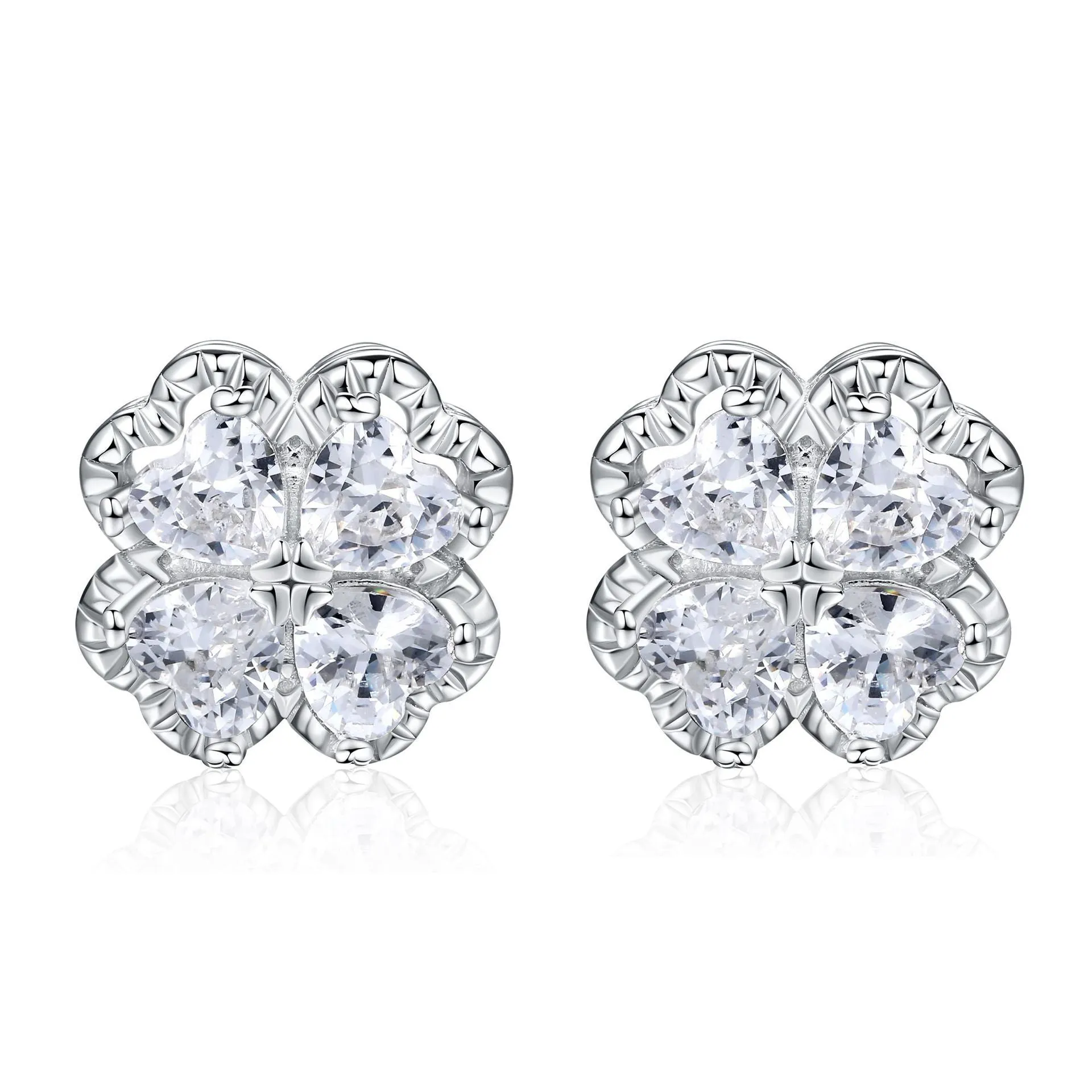 Close-up of women's white gold coloured heart shaped earrings with a four-leaf clover design, made from 925 silver and inlaid zircon stones.