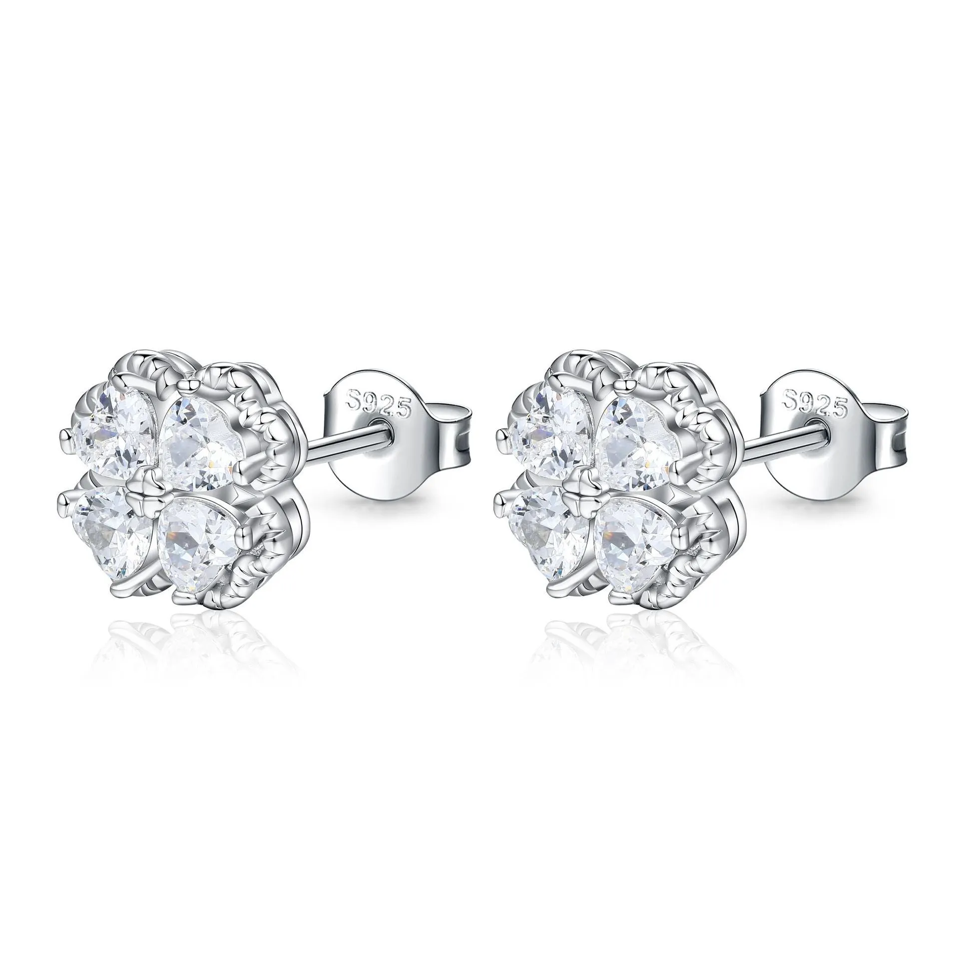 Close-up of women's white gold coloured heart shaped earrings with a four-leaf clover design, made from 925 silver and inlaid zircon stones.