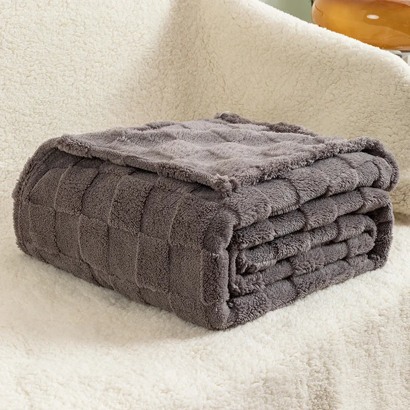 Geometric pattern polyester blanket in cream colour showing textured design and thickened construction
