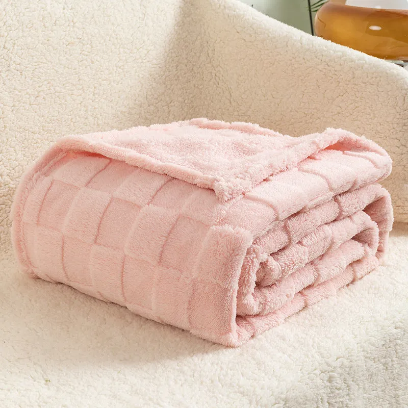 Geometric pattern polyester blanket in cream colour showing textured design and thickened construction