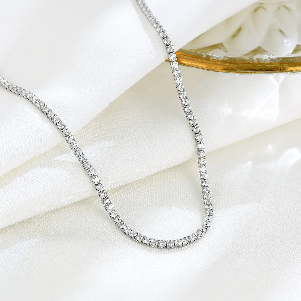 Women's sterling silver necklace with round design and diamond treatment on 925 silver chain
