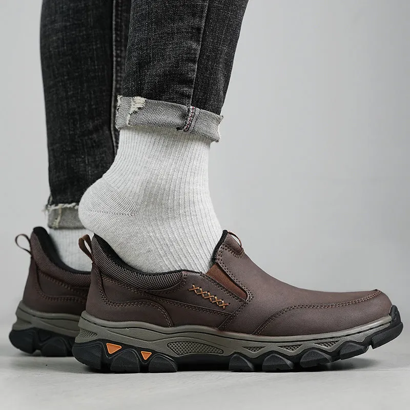 Men's dark brown casual leather shoes with round toe and flat rubber sole.