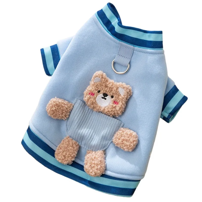 Soft navy blue dog sweater with light blue striped cuffs and blush bear decorations