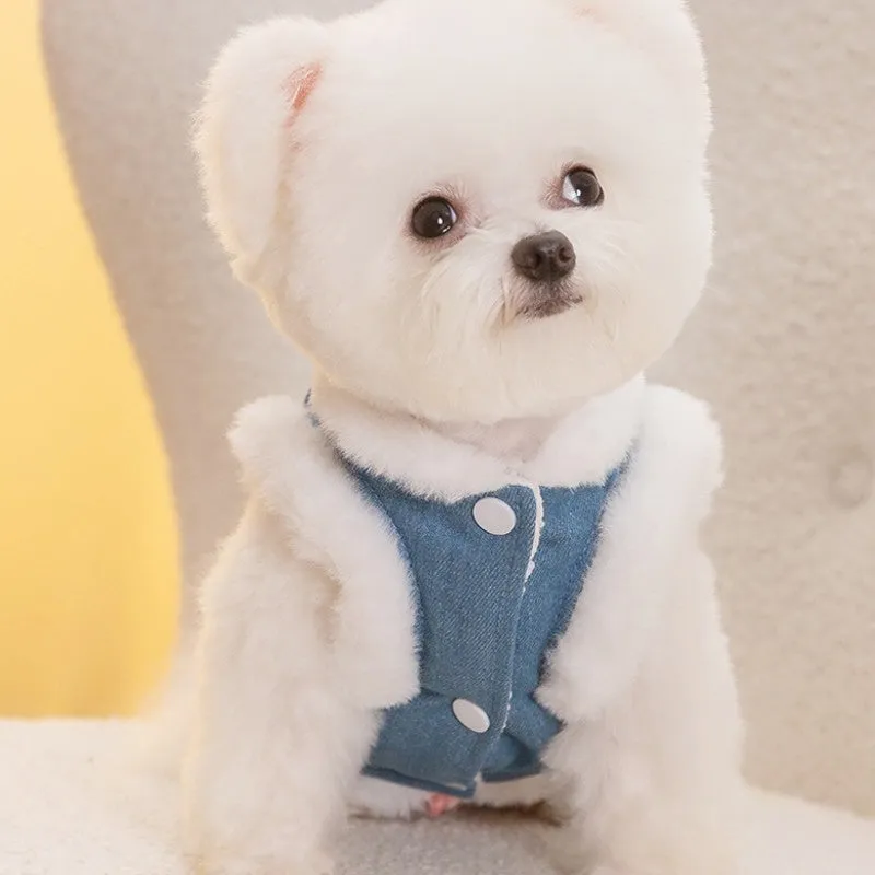 Denim dog vest with white wool lining, embroidered teddy bear patches, wooden buttons, and metal D-ring on blue background