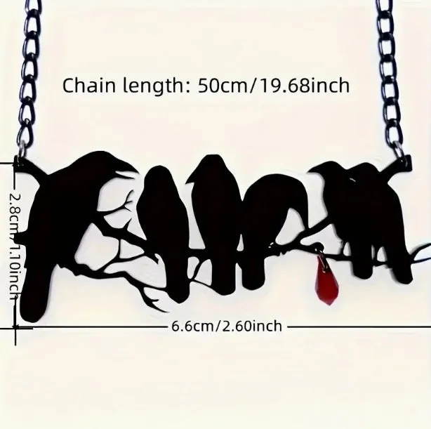 Black Gothic crow necklace with electroplated finish and cross chain on dark background