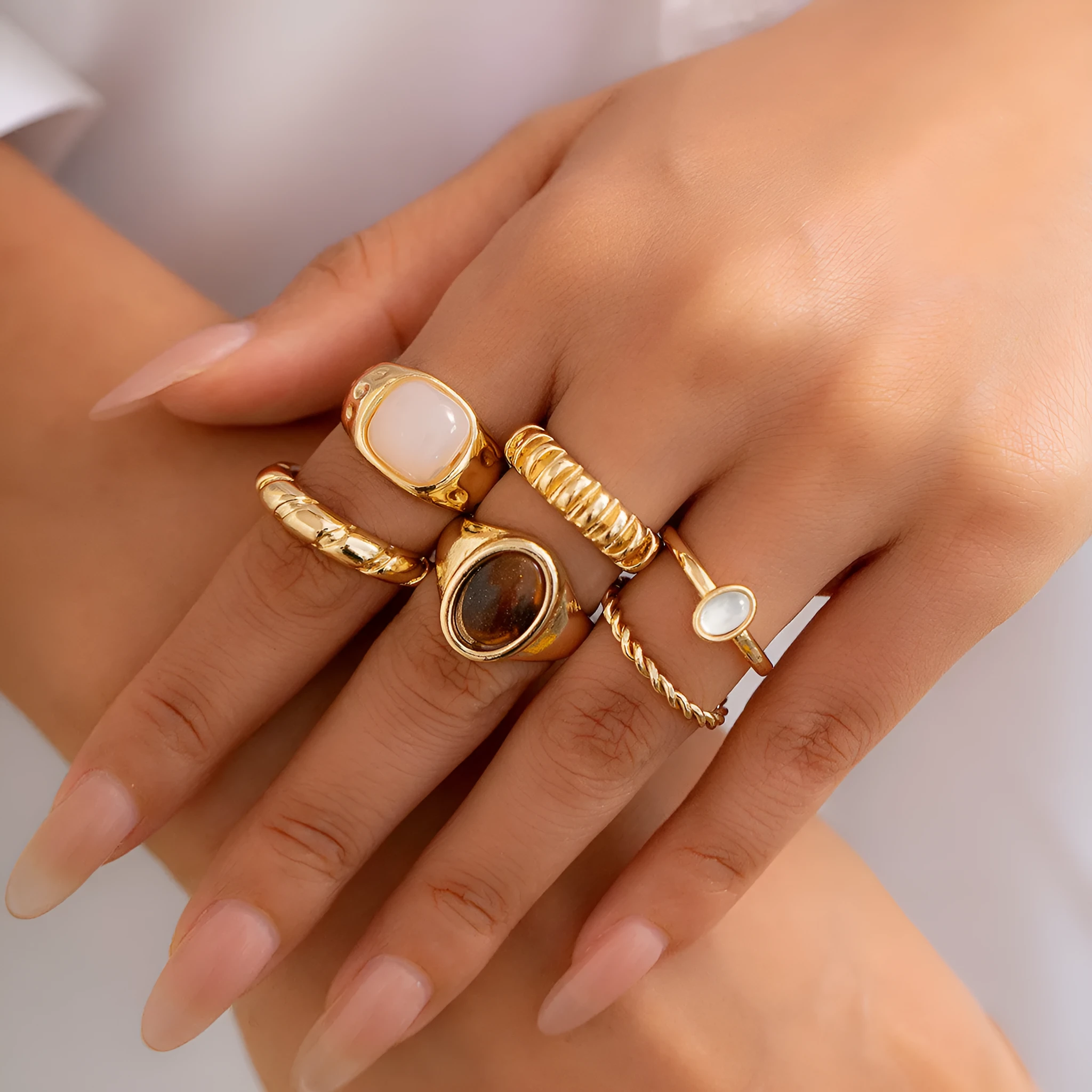 Set of six light gold geometric and round alloy rings with electroplated finish