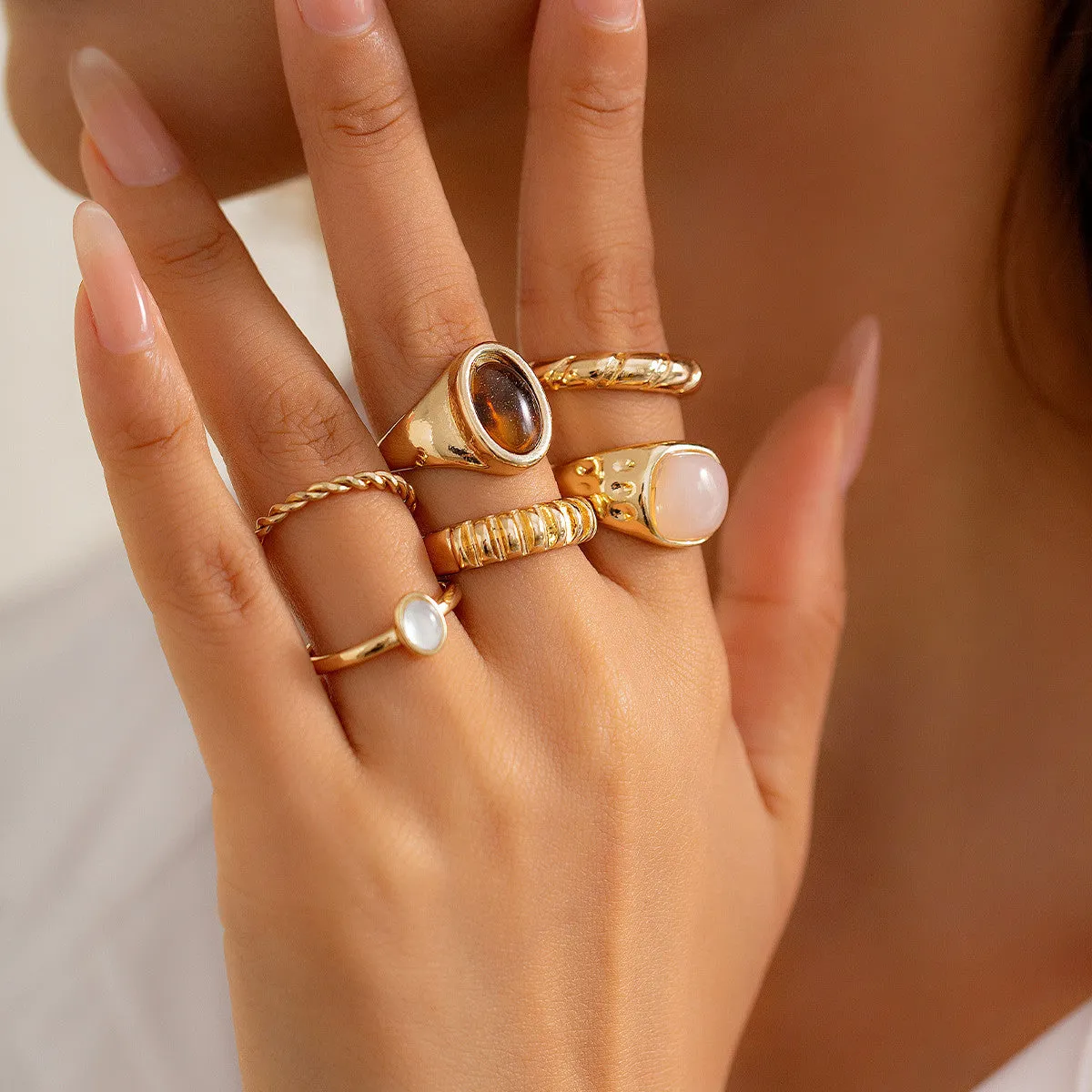 Set of six light gold geometric and round alloy rings with electroplated finish
