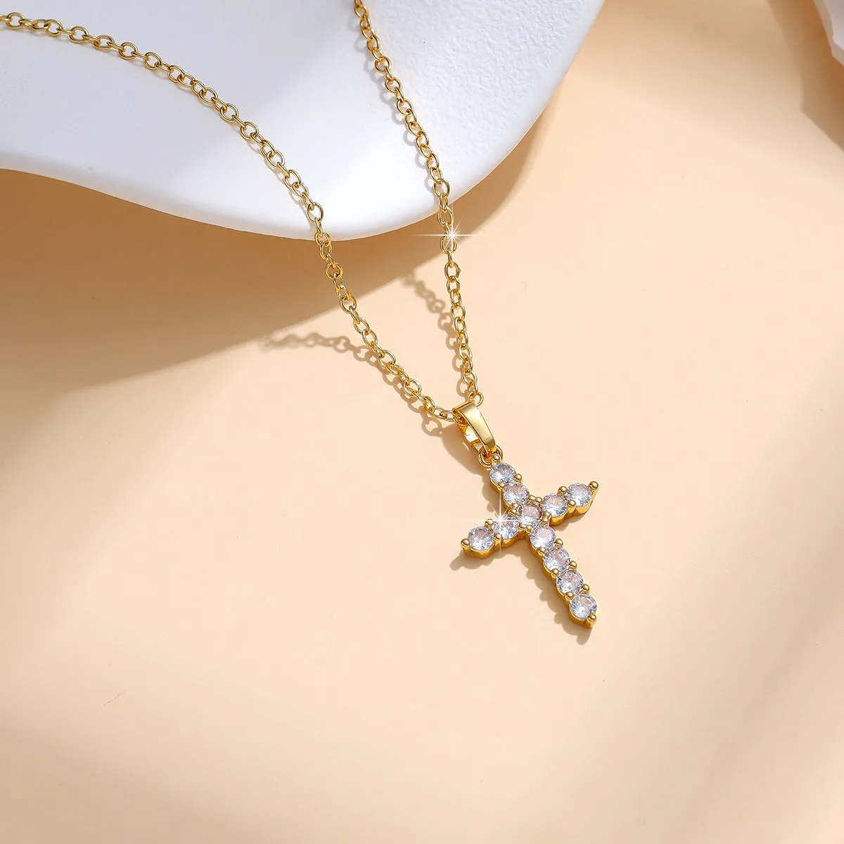 Gold plated cross necklace for women with cubic zirconia stones on a 45 cm chain, shiny finish