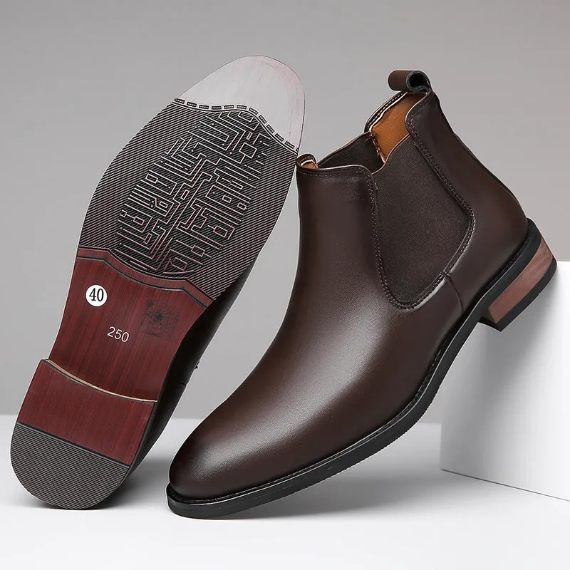 Men's black pointed toe Chelsea boots with a high-top design and decorative stitching on a rubber sole.