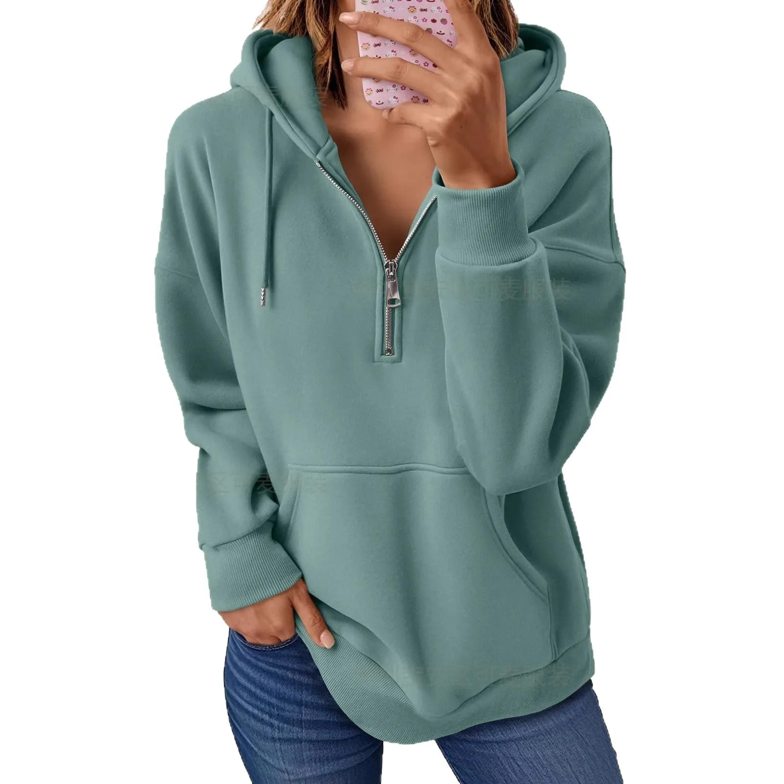 Polyester pullover hooded sweatshirt in peacock green with zip pocket on front. Long sleeve, solid colour, casual style.