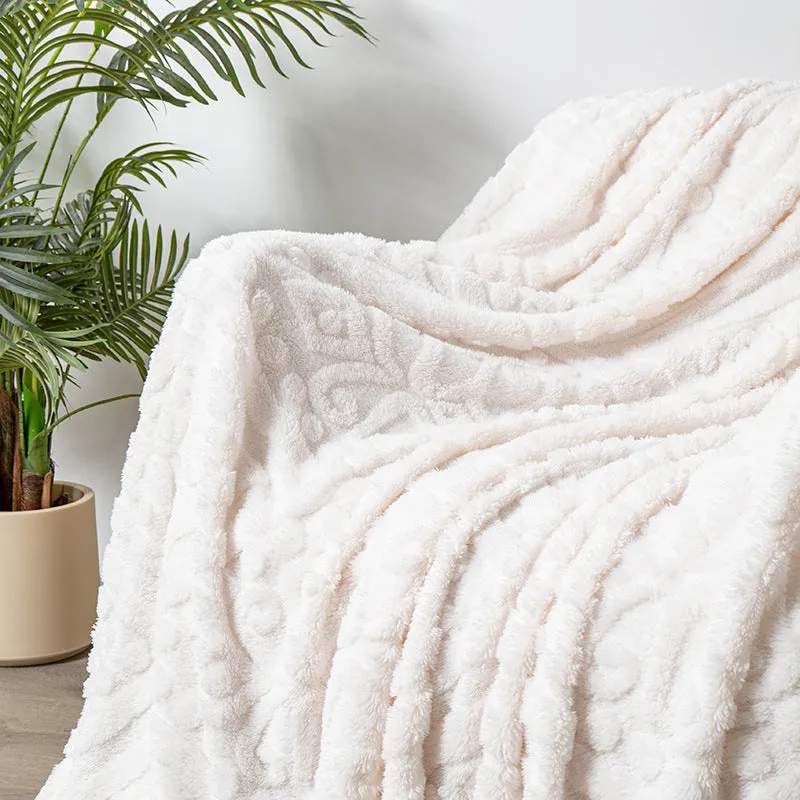 Cotton velvet jacquard sofa blanket showing plant flower pattern on solid colour background