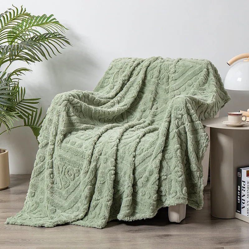 Cotton velvet jacquard sofa blanket showing plant flower pattern on solid colour background