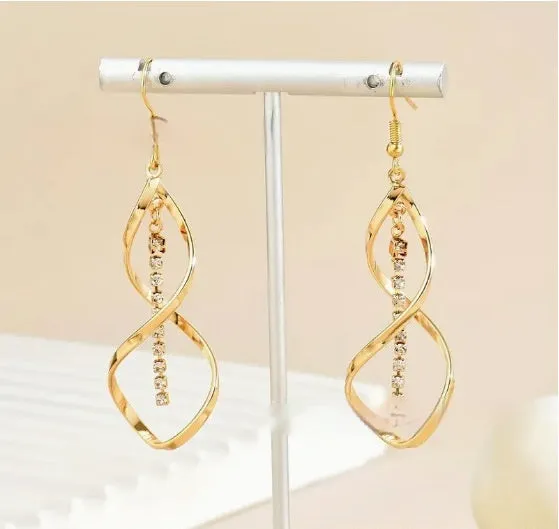 Gold geometric spiral earrings with ellipse elements and electroplated finish