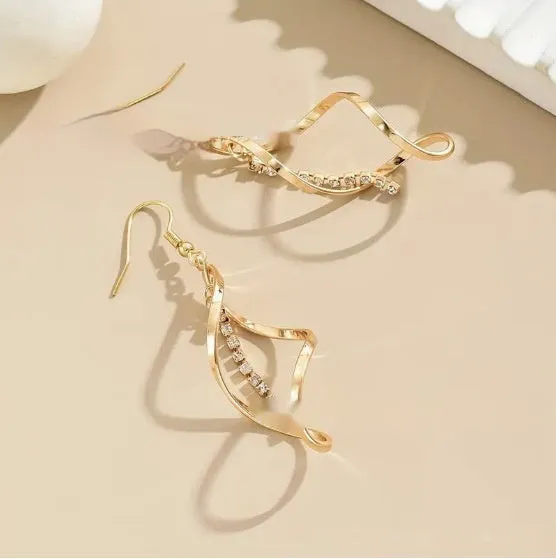 Gold geometric spiral earrings with ellipse elements and electroplated finish