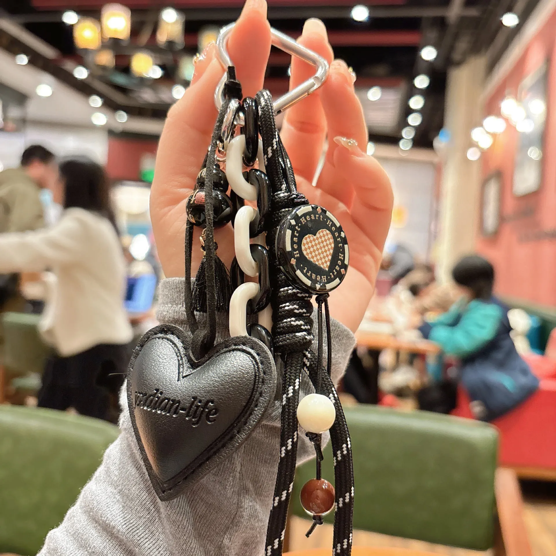 Leather keychain with heart-shaped small gourd pendant in brown, woven rope strap
