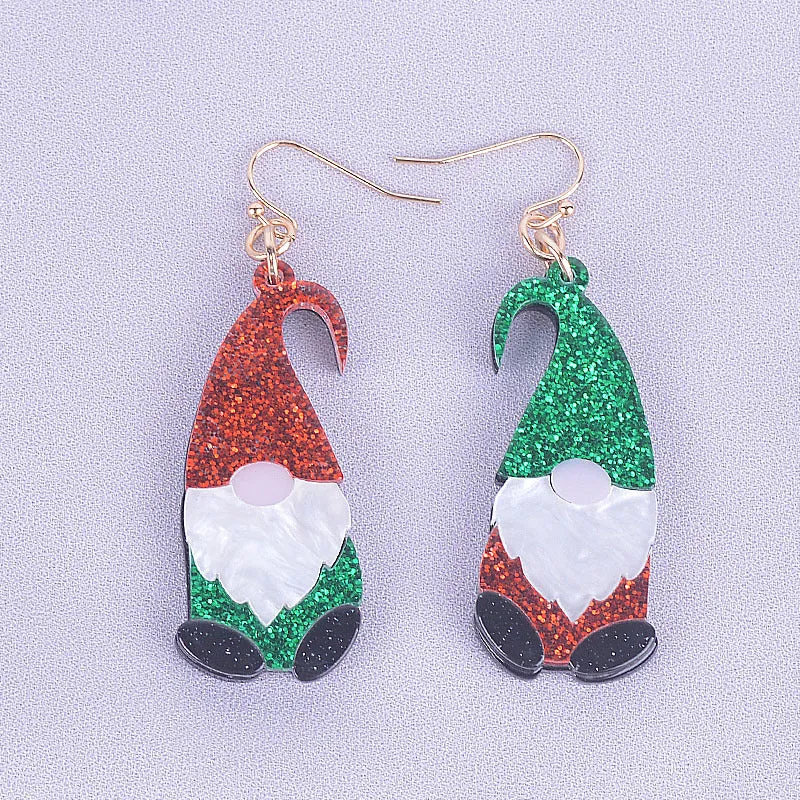 Cartoon Santa Claus character earrings in acrylic with red, green, or mixed hat styles