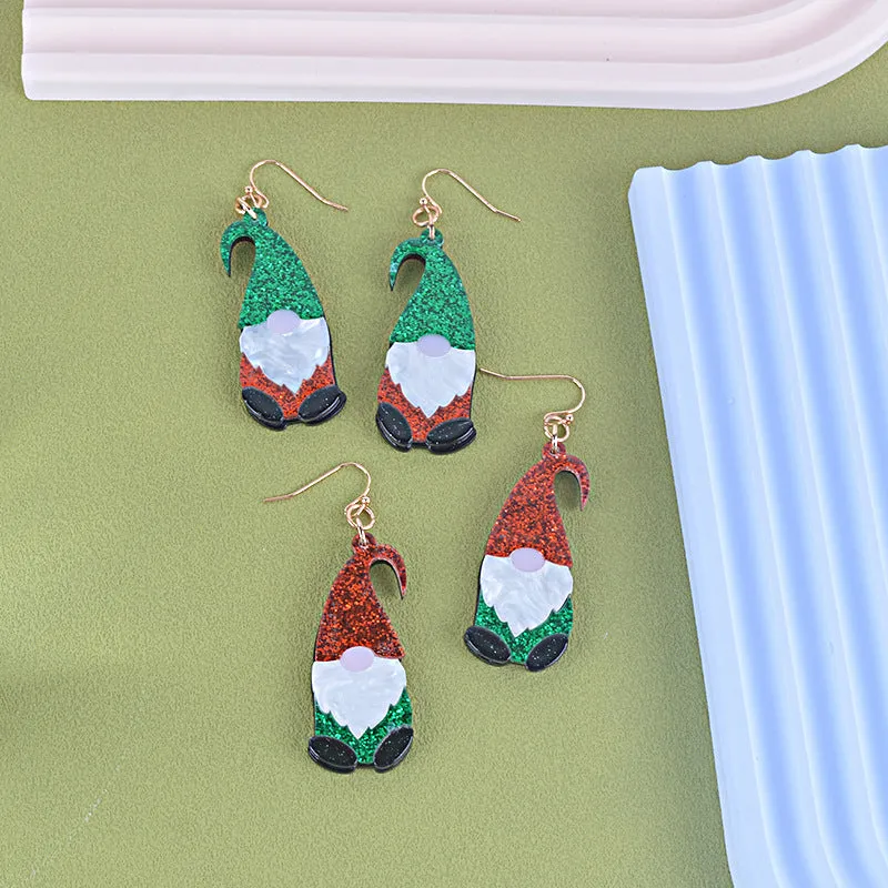 Cartoon Santa Claus character earrings in acrylic with red, green, or mixed hat styles