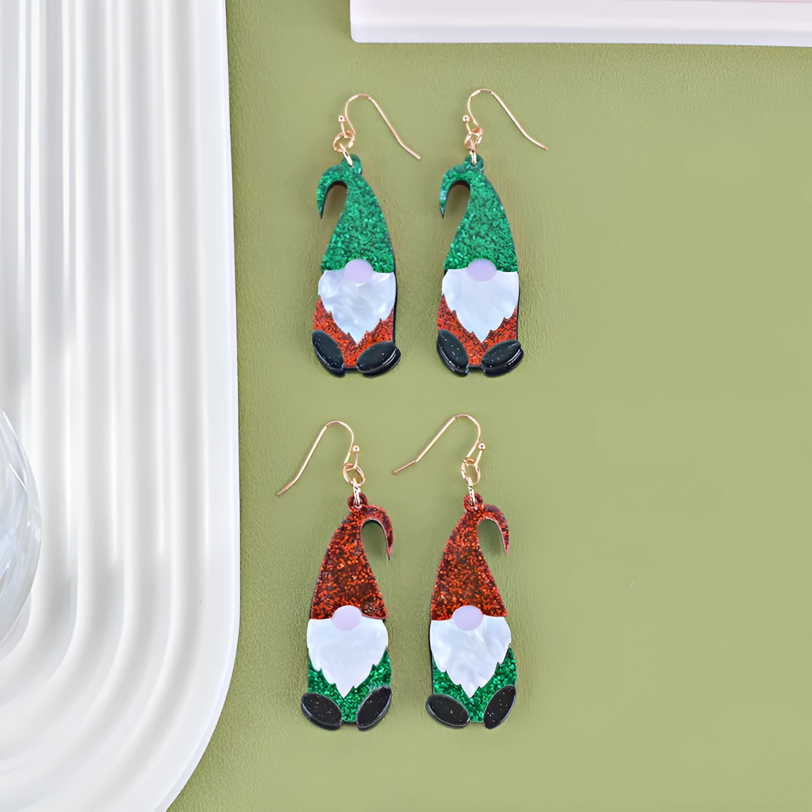 Cartoon Santa Claus character earrings in acrylic with red, green, or mixed hat styles