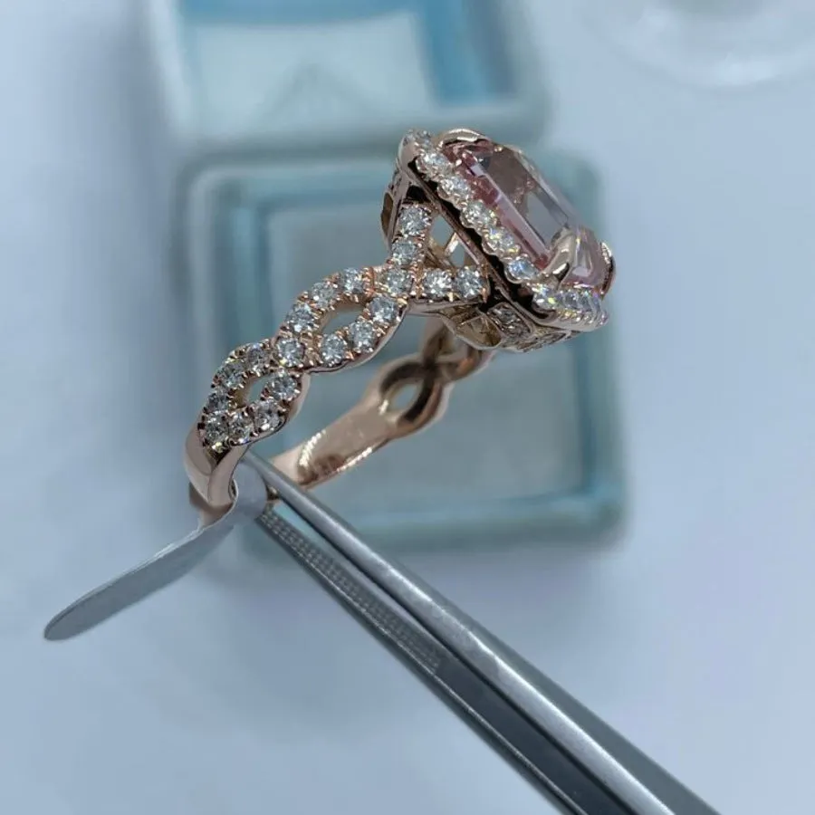Rose gold geometric alloy ring on a plain background, showing its shape and electroplated finish.
