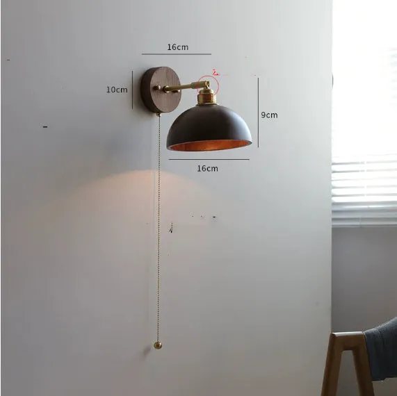 Nordic style wooden wall mounted bedside lamp in a bedroom setting