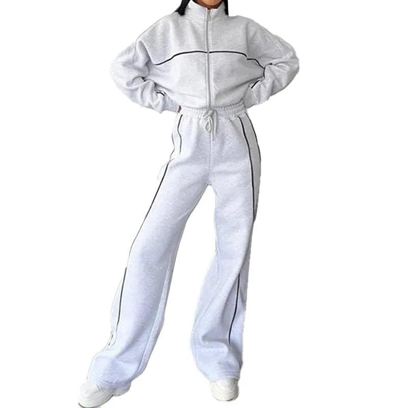 Casual polyester suit set showing a long sleeve mock neck hoodie and striped trousers on a model.
