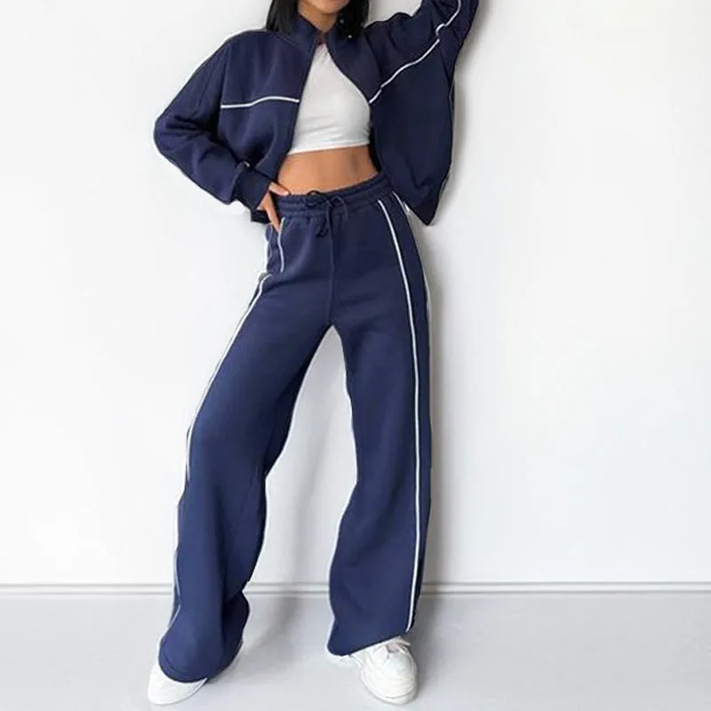 Casual polyester suit set showing a long sleeve mock neck hoodie and striped trousers on a model.