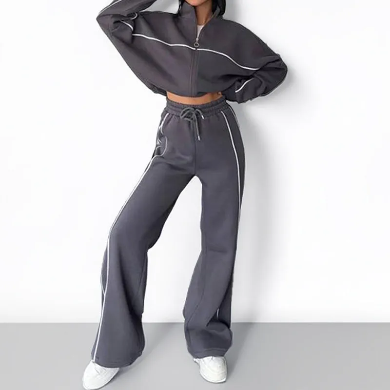 Casual polyester suit set showing a long sleeve mock neck hoodie and striped trousers on a model.