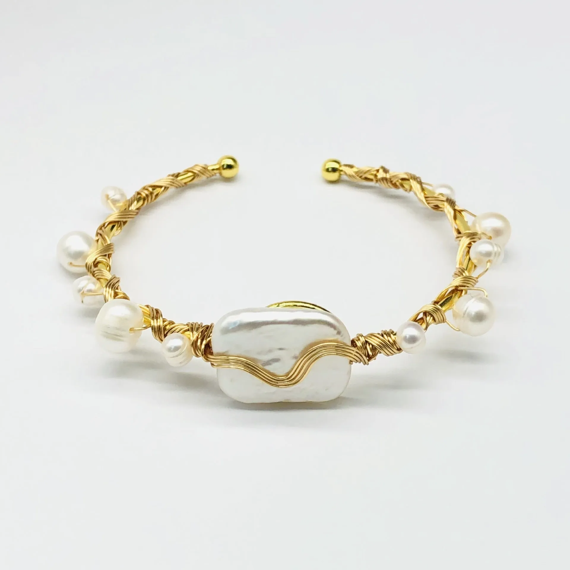 Natural freshwater pearl handmade wire-wrapped bracelet in gold titanium steel on wrist