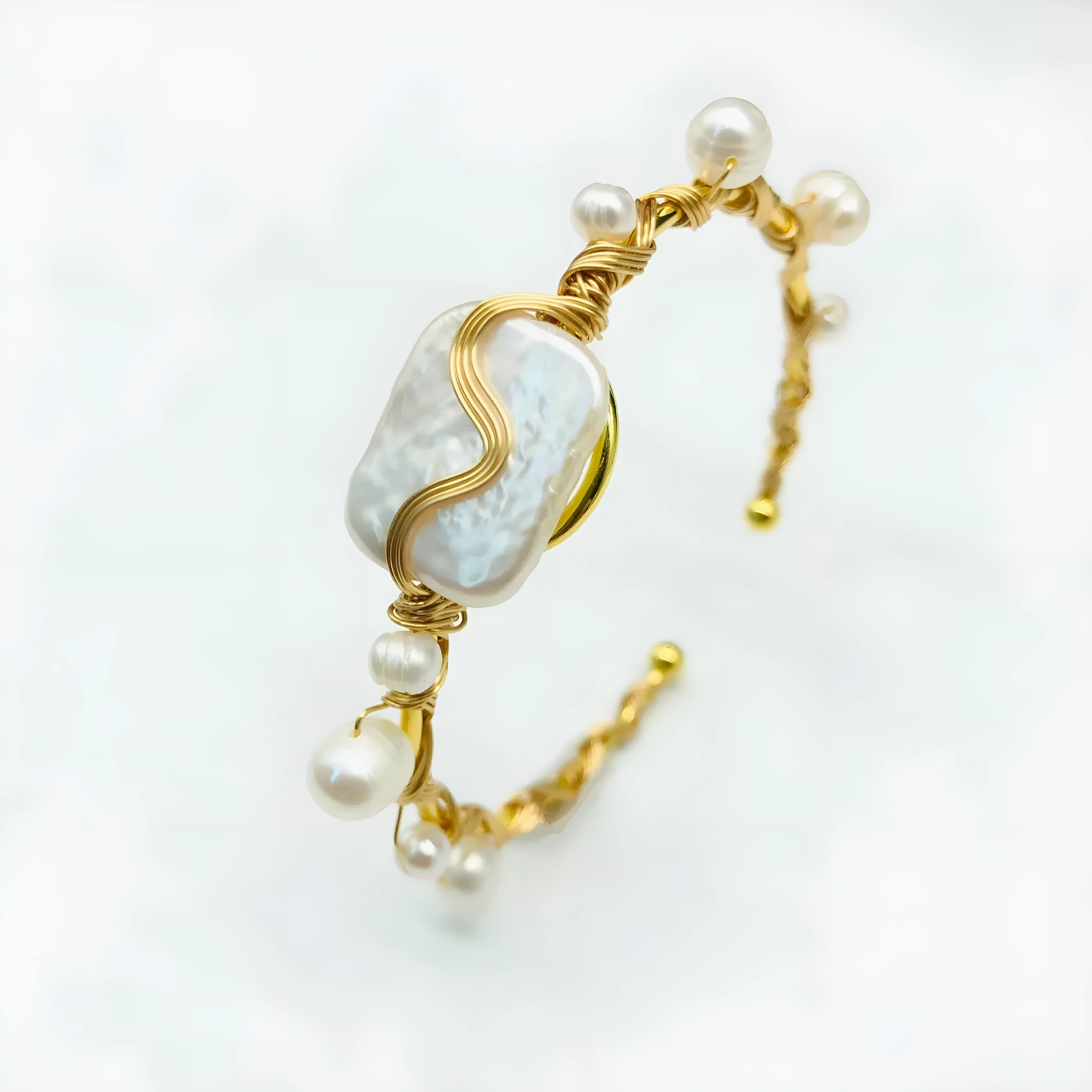 Natural freshwater pearl handmade wire-wrapped bracelet in gold titanium steel on wrist