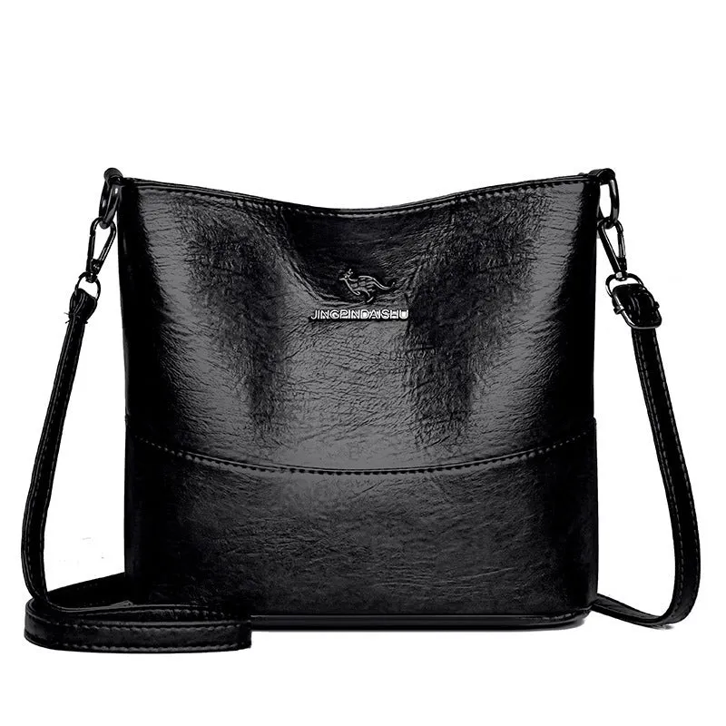 Women's soft leather bucket shoulder bag in black with sewing line detailing and mobile phone pocket