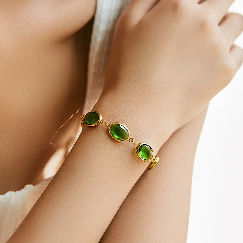 Geometric copper bracelet with blue inlaid glass elliptical design for women.