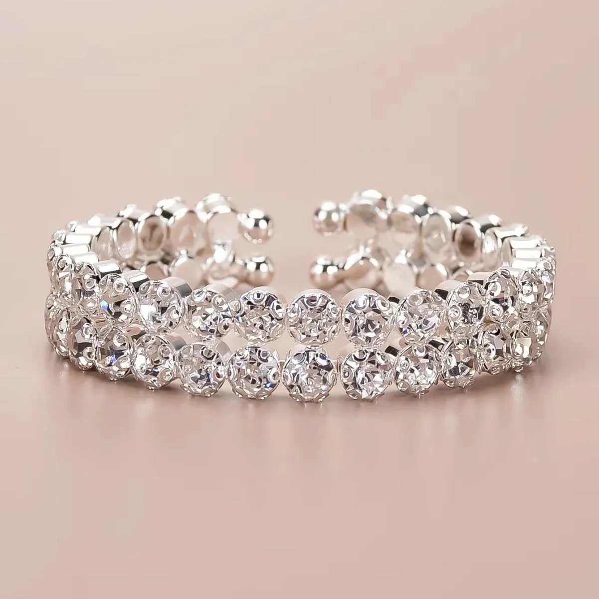 Silver elastic bracelet with double row of large rhinestones and wide opening design