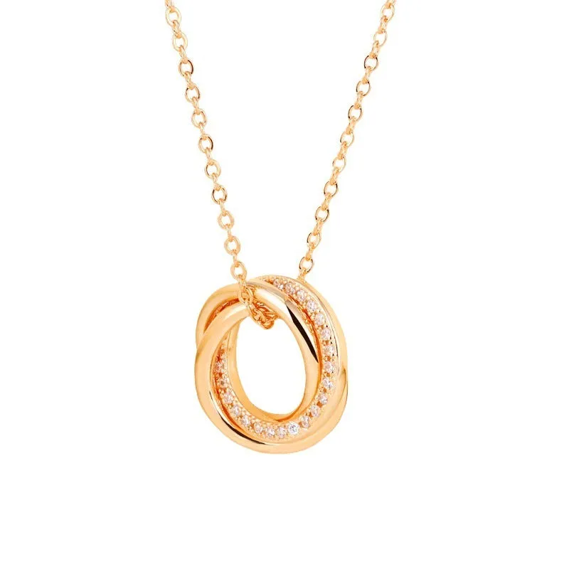 Geometric copper necklace with micro-inlaid interlocking three rings in champagne gold on woman