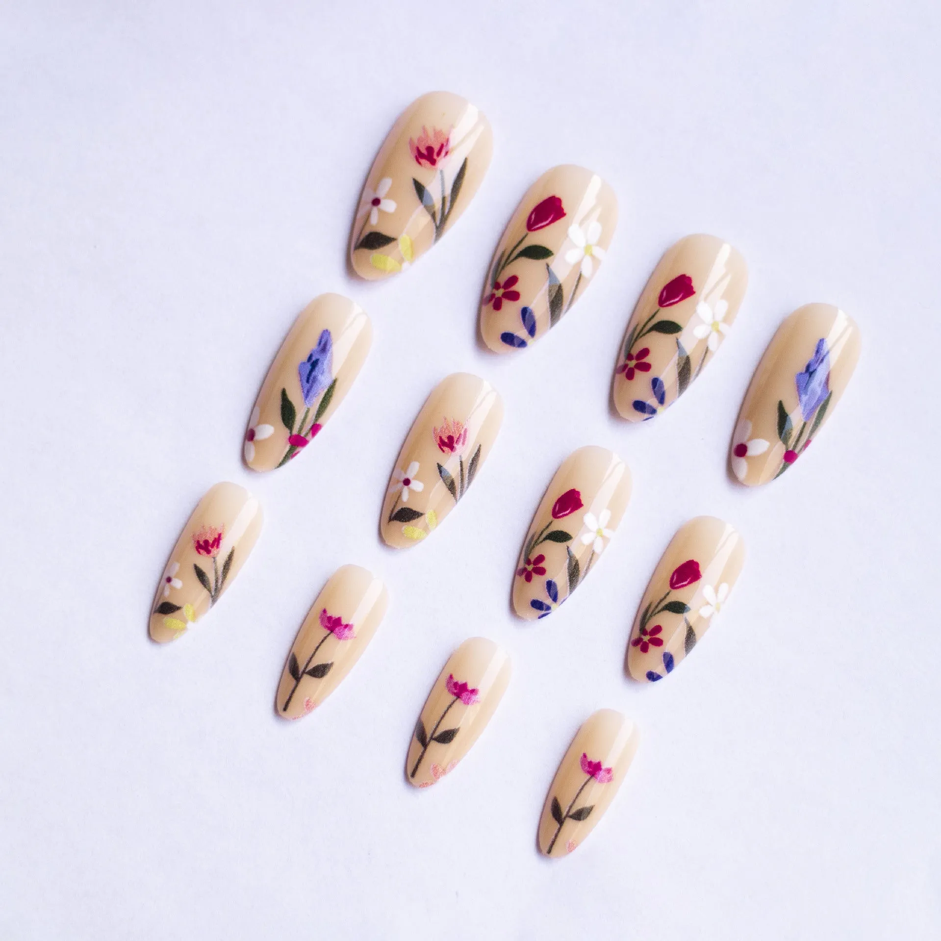 Removable flower pattern nail art set for almond-shaped nails in a rose and tulip design.
