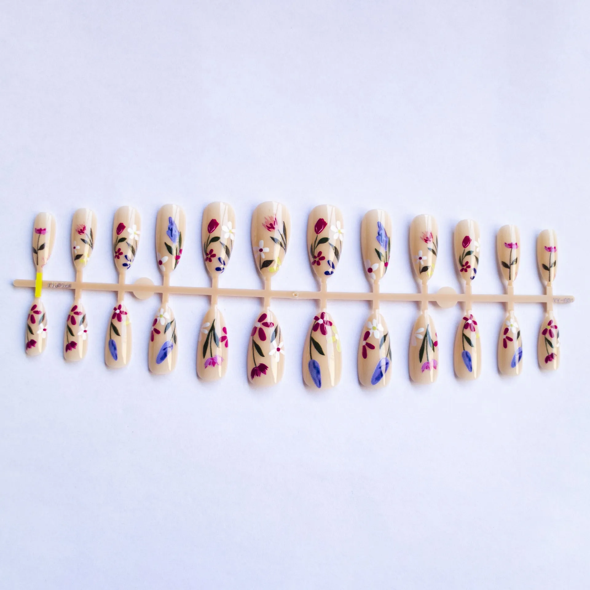 Removable flower pattern nail art set for almond-shaped nails in a rose and tulip design.
